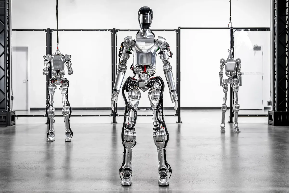 Autonomous humanoid robots by Figure AI deployed in BMW's advanced automotive manufacturing facility.